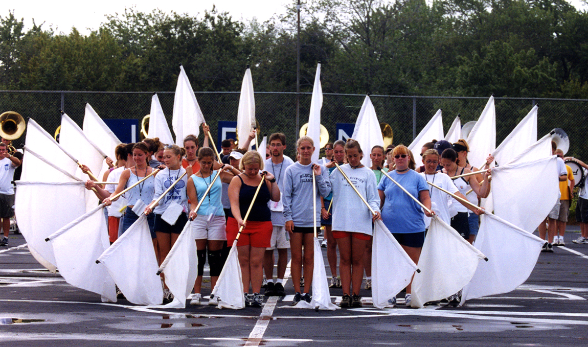 Members of the Marching Band practice with flags, circa 2001