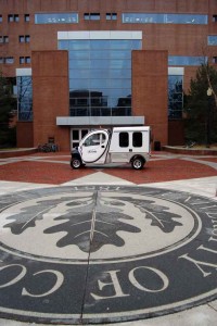 The new GEM light utility electric vehicle takes up residence at Babbidge Library.