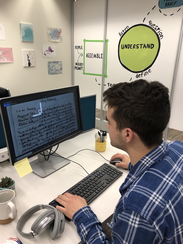 Student Matthew Mulhall working in the Greenhouse Studios on developing a neural network to identify handwritten characters.