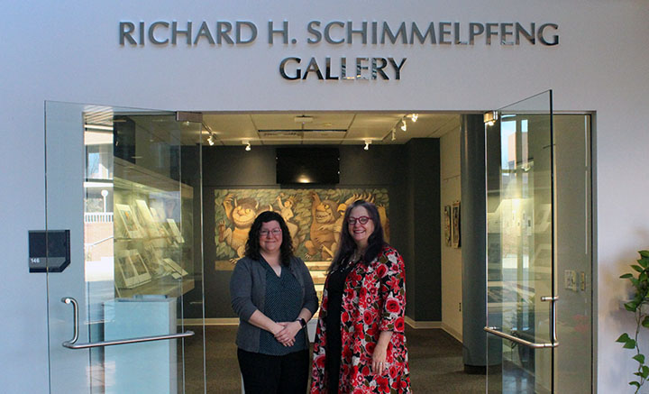 Rebecca Parmer, Head of Archives & Special Collections and Dean Anne Langley in front of the newly dedicated Richard H. Schimmelpfeng Gallery